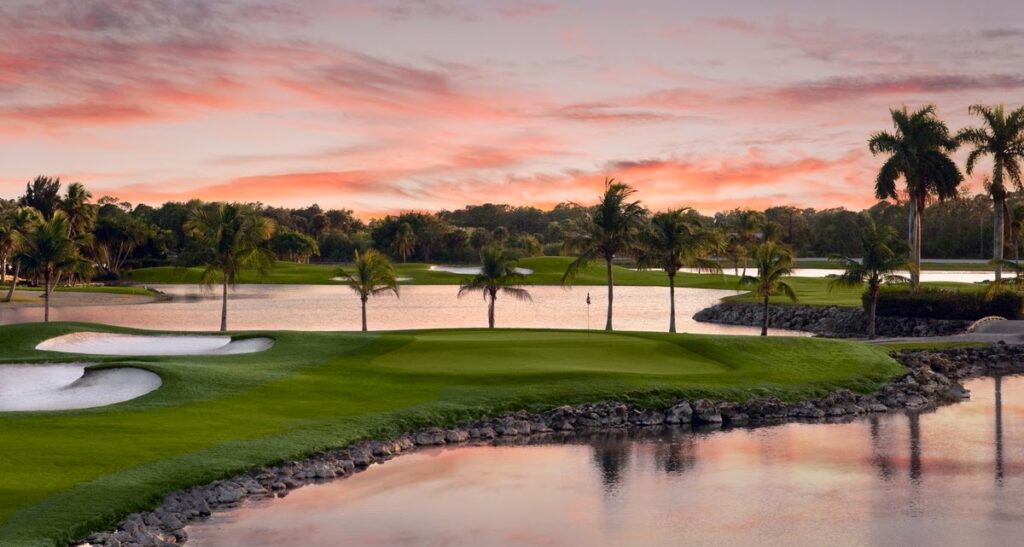 Wide angle view of The Classics golf course designed by Gary Player, rolling fairways and elegant club facilities, photorealistic 8K, late afternoon light