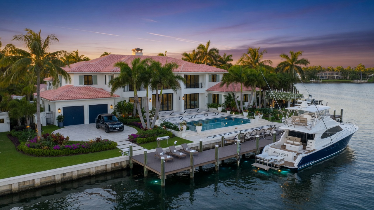 Ultra-detailed 8K photograph of a newly renovated Aqualane Shores waterfront estate with expansive dock, luxury yacht, and manicured tropical landscaping